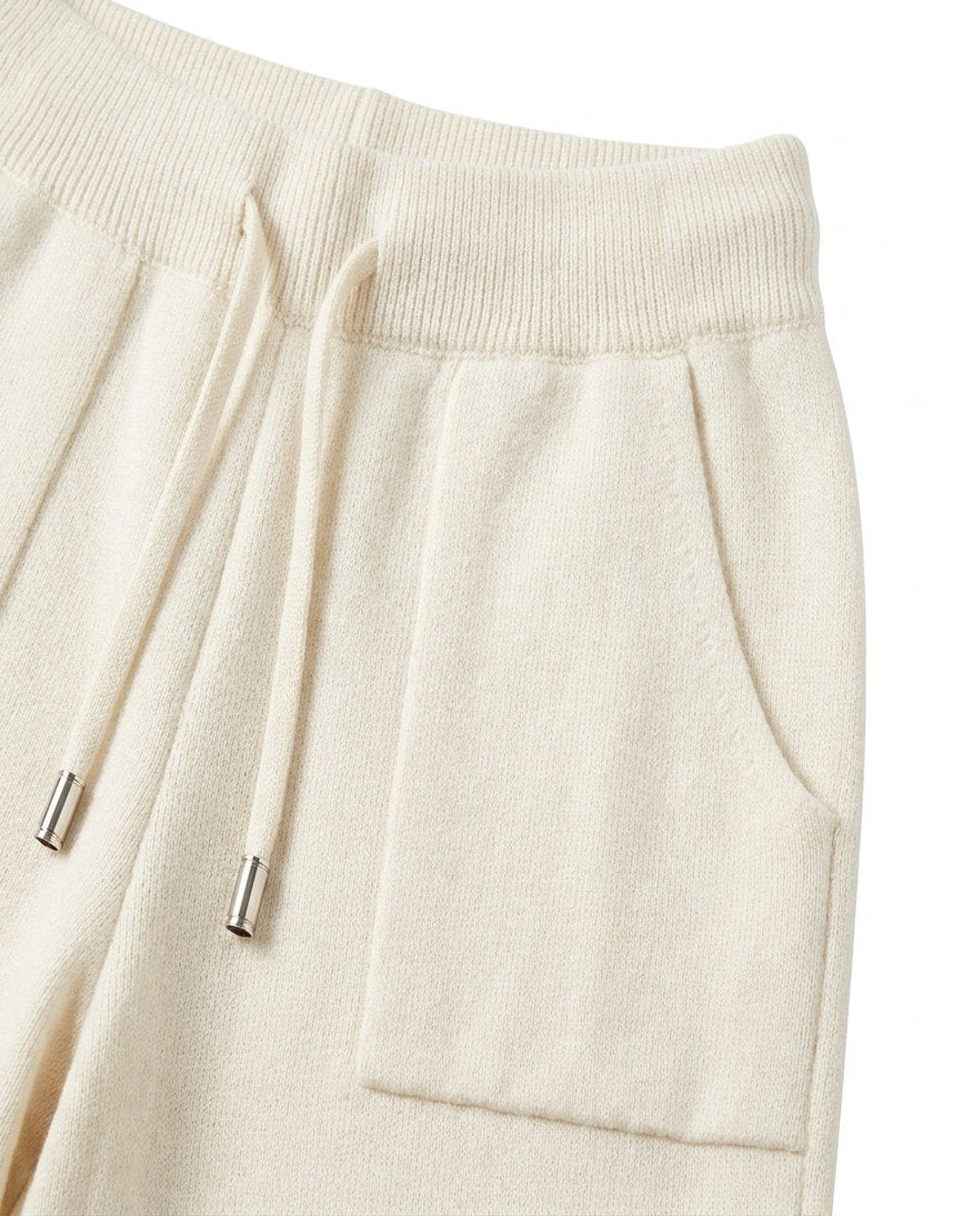 The Snow Day Set in Snowfall - close detail of the knit drawstring, silver tips and patch pocket, Fox & Ocean kids knit tracksuit