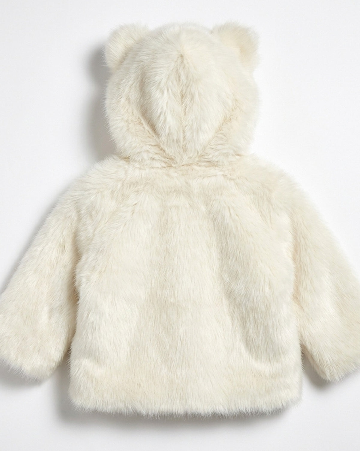 The Little Bear kids faux fur coat in Snowfall ivory white — back view, hood laid flat showing both bear ears, Fox & Ocean