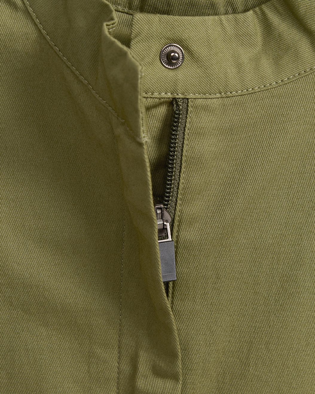 Meadow green kids jumpsuit zip front and snap-closure stand collar detail